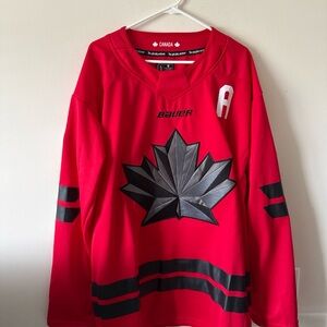 Bauer Red Hockey Jersey with Black Maple Leaf Accents